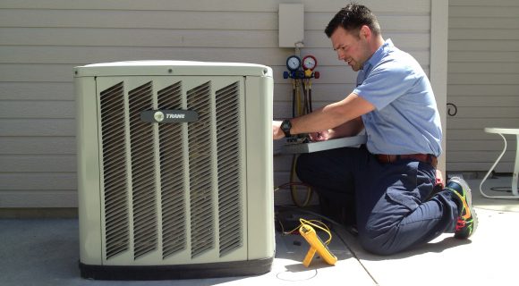 Technician performing an AC Installation at a home in Quogue, NY