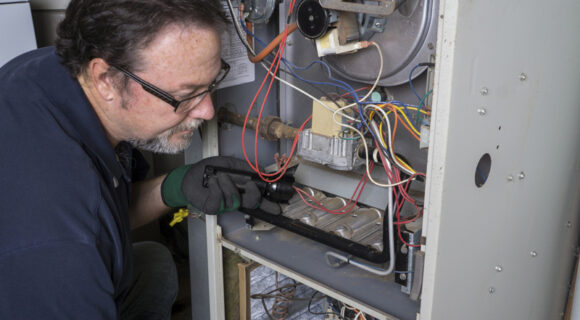 technician providing Furnace Repair Services
for Quogue, NY